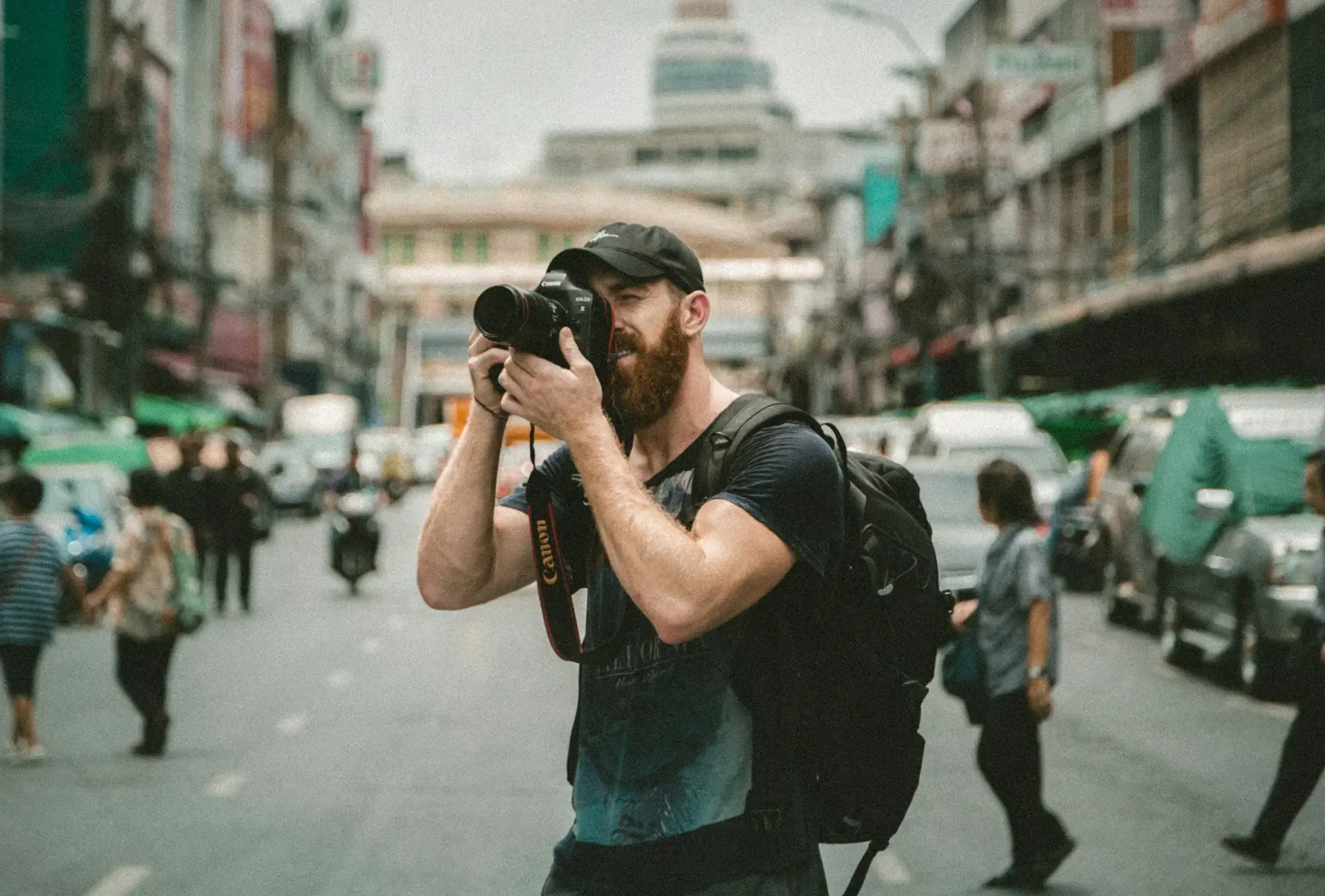 one of our photo tour guides holding a camera